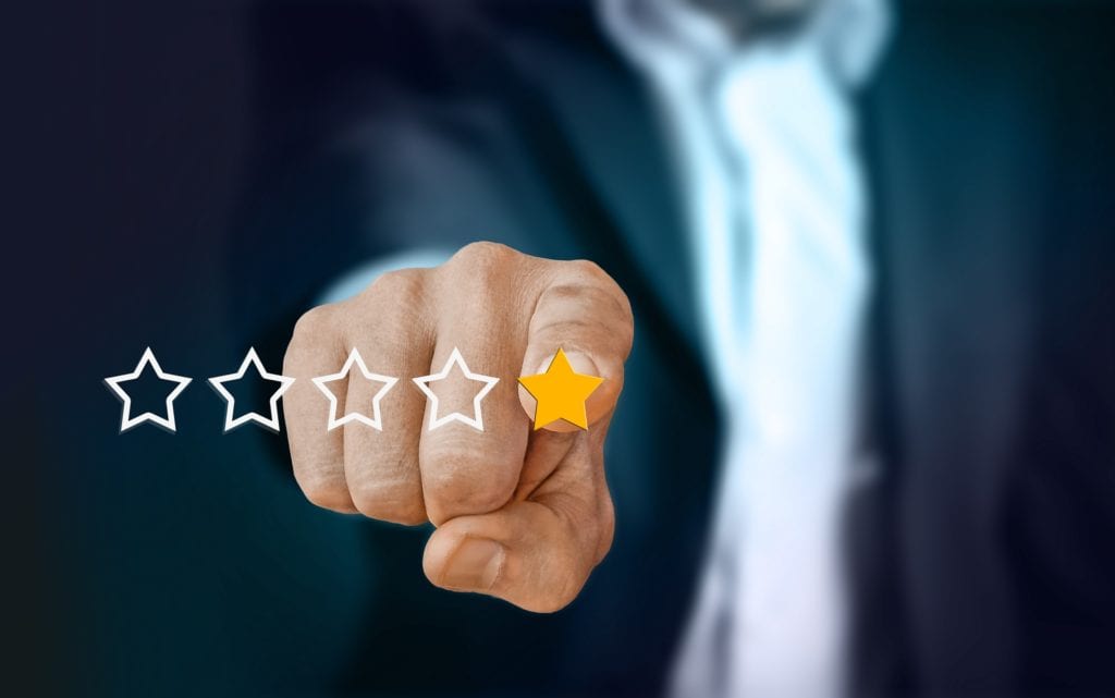 Reputation management: Finger pointing at one star out of five